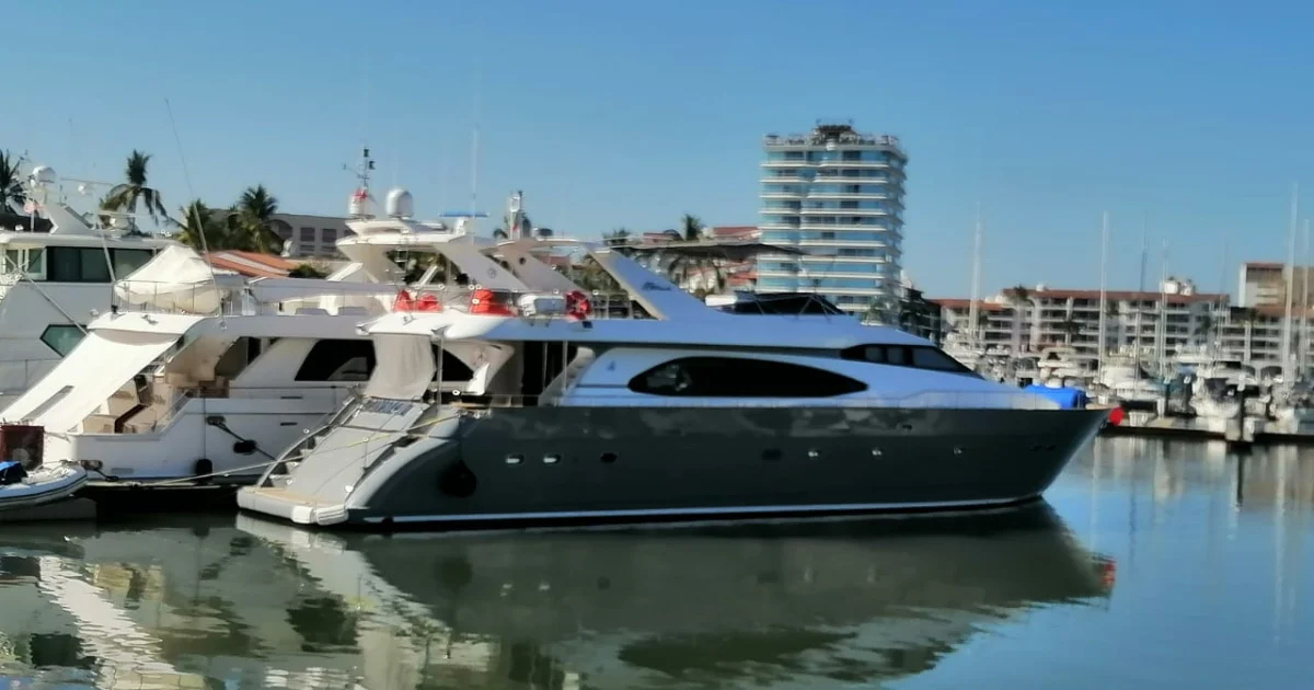 The 85 ft Azimut yacht docked at Marina Vallarta with the Puerto Vallarta skyline behind